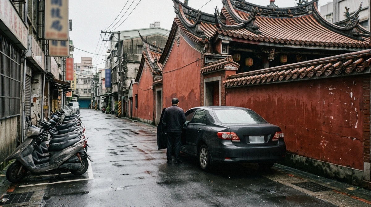 A black private tour car waiting on a quiet Taipei street beside a temple wall on a private Taipei tour, Taiwan