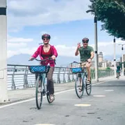 Cyclists riding past Longshan Temple on the four-hour morning cycling tour, one of the small-group Taipei tours in Taiwan